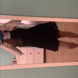 a sheer black lace up dress